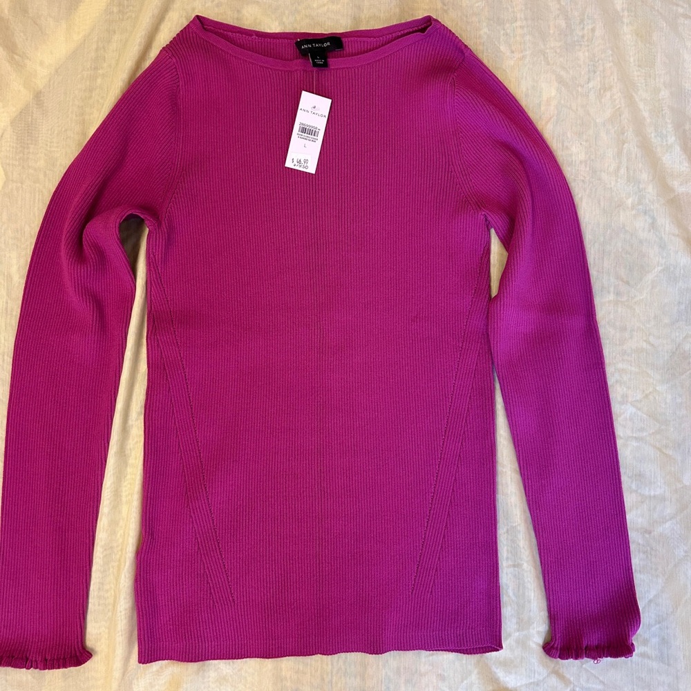 Pink sweater with lettuce trim sleeves